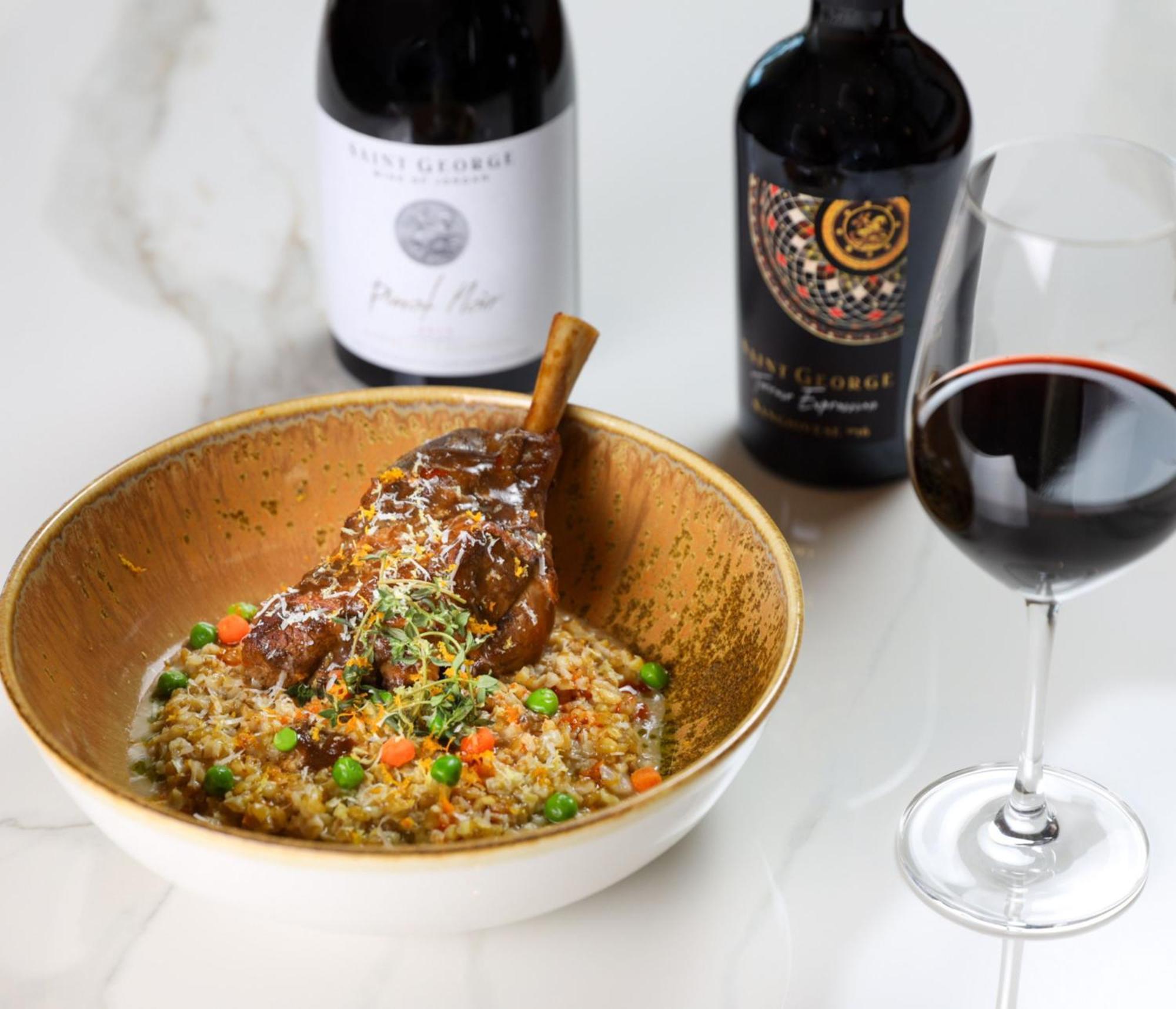Crowne Plaza Jordan Dead Sea Resort & Spa By Ihg Sweimeh Kültér fotó A lamb leg confit served with a glass of red wine